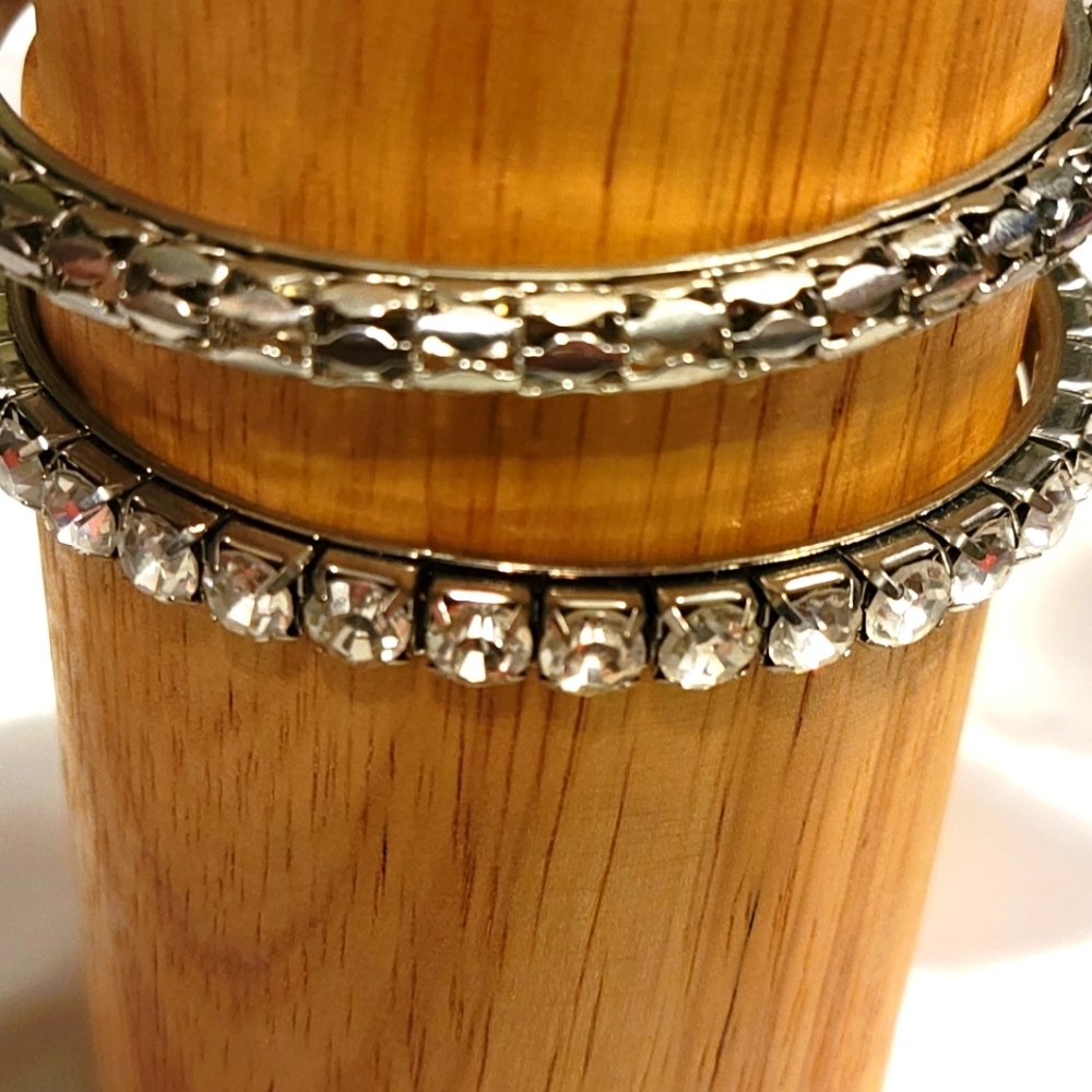 Silvertone being bracelets.